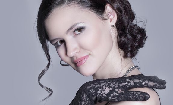 portrait of stylish young woman.isolated on gray background.photo with copy space