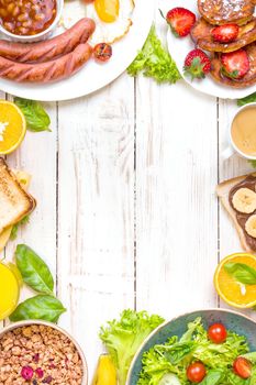 Assortment of breakfast choices. English breakfast, sausages, fried eggs, bacon, salad, granola, cheese sandwich, pancakes, chocolate cream and banana toast, coffee, fresh orange juice. Space for text