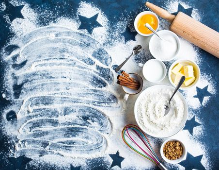 Baking background. Flour, white, brown sugar, eggs, butter, milk, cinnamon sticks, whisk, rolling pin. Ingredients for baking. Kitchen utensils. Space for text. Top view. Making baked goods. Concept