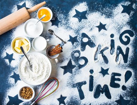 Baking concept. Flour, white, brown sugar, eggs, butter, milk, cinnamon sticks, whisk, rolling pin. Ingredients for baking. Kitchen utensils. Top view. Making baked goods. Set of assorted ingredients