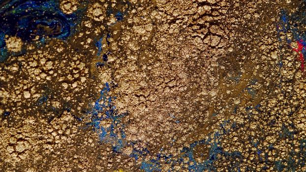 Background of gold dust in a silvery mist with blue, yellow streaks. A unique, natural background created in the technique of the flowing art of resin. Abstractions made of liquid marble. Deep ink blanks.