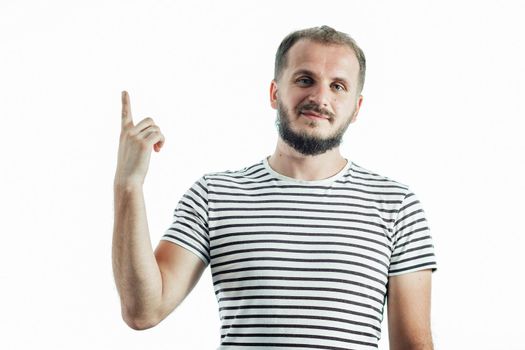 Young handsome bearded man wearing striped t-shirt showing and pointing up with finger number one while confident and happy.