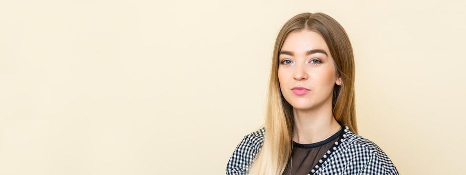 Portrait of a casual business woman sitting at her workplace in home office.