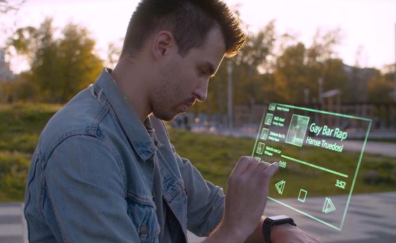 Man in the city use the transparent player. Futuristic musical device. Video and animation