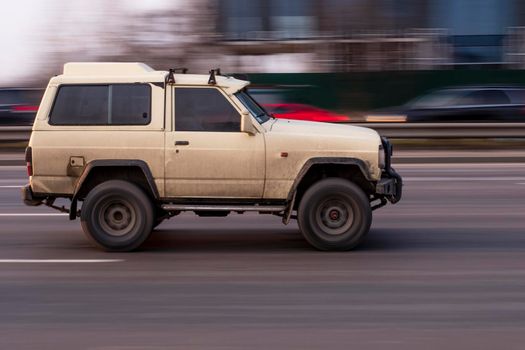 Ukraine, Kyiv - 11 March 2021: White Nissan Patrol car moving on the street. Editorial