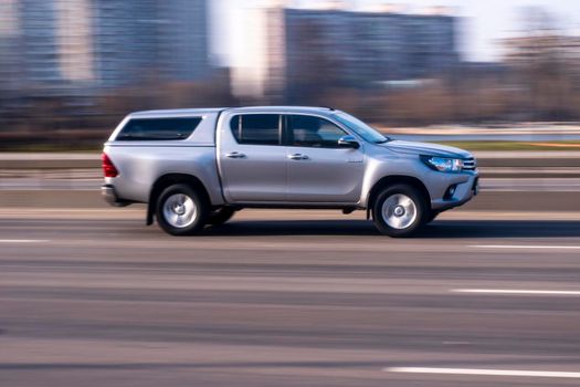 Ukraine, Kyiv - 21 March 2021: Silver Toyota Hilux car moving on the street. Editorial