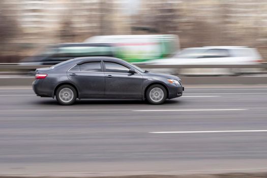Ukraine, Kyiv - 18 March 2021: Gray Toyota Camry car moving on the street. Editorial
