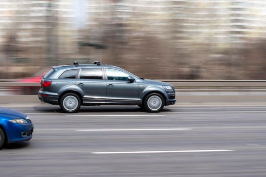 Ukraine, Kyiv - 18 March 2021: Gray Audi Q7 car moving on the street. Editorial