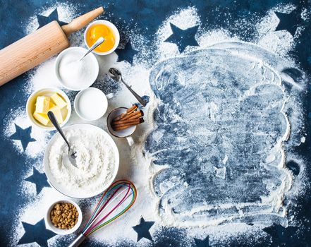 Baking background. Flour, white, brown sugar, eggs, butter, milk, cinnamon sticks, whisk, rolling pin. Ingredients for baking. Kitchen utensils. Space for text. Top view. Making baked goods. Concept