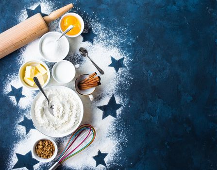 Baking background. Flour, white, brown sugar, eggs, butter, milk, cinnamon sticks, whisk, rolling pin. Ingredients for baking. Kitchen utensils. Space for text. Top view. Making baked goods. Concept