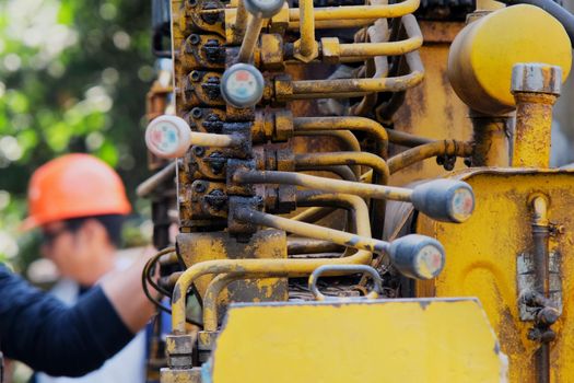 Engineering control crane hydraulic machine by hand. Close up of old levers for controlling mobile construction equipment. control crane truck