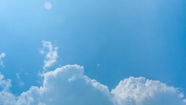 The blue sky in summer day. Blue sky white clouds. White clouds background. Nature weather of clear sky.