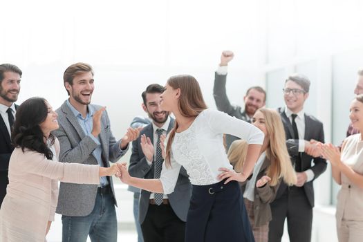 happy employees congratulating their leader. success concept