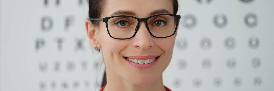 Young woman optometrist smiling, close-up. Eyesight examination, ophthalmologist. Optic consultation