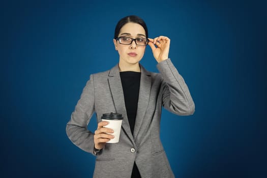 Photo of attractive business lady confident manager worker in glasses. blue color background.