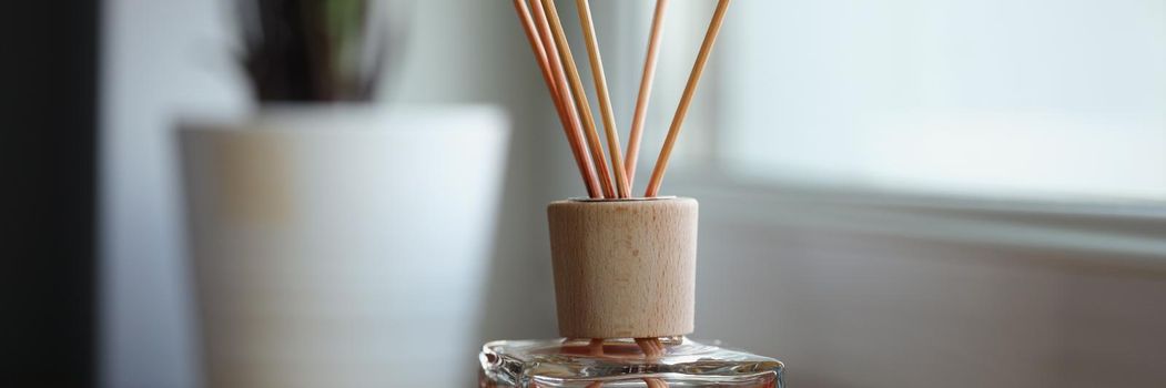 Incense sticks on the windowsill, close-up, blurry. Home fragrances, aroma diffuser. A mixture with a pleasant smell