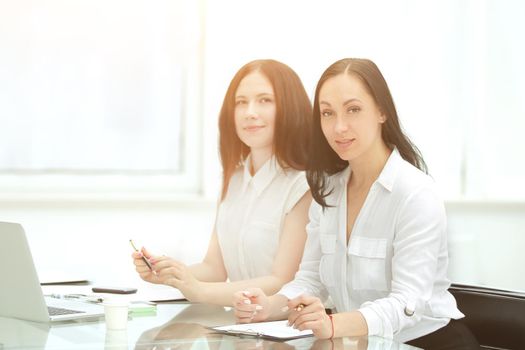 business woman and her assistant at the office Desk.