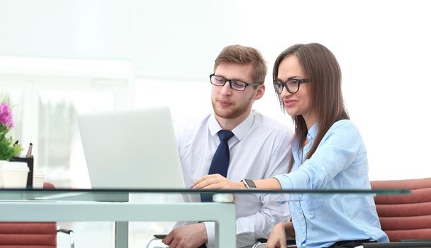 business couple looking at laptop screen.photo with copy space.