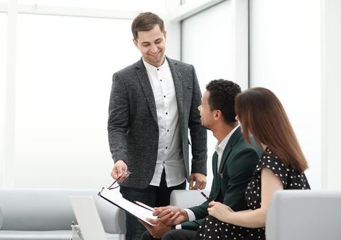 couple reads the terms of the contract in the office . photo with copy space