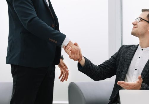 close up. handshake of business partners on a light background . concept of cooperation