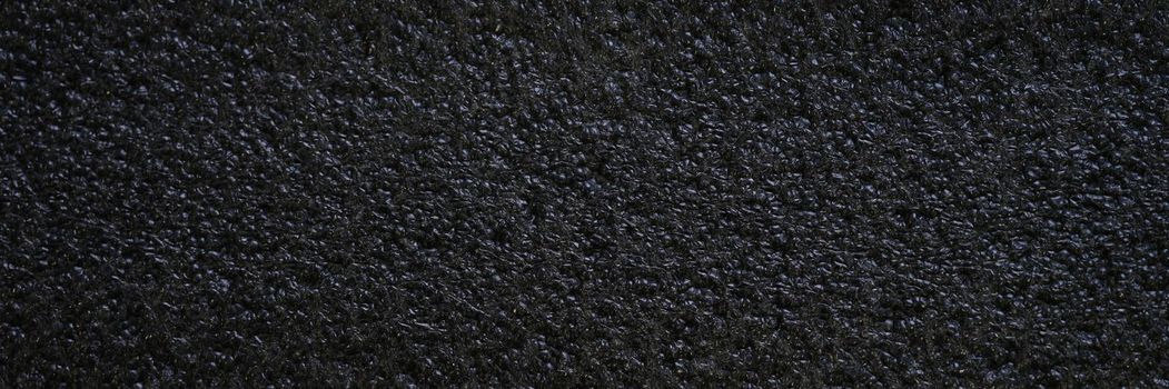 Black background, porous seamless texture pattern, design element close-up. Roofing felt, granular asphalt