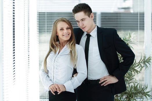 business couple standing in a modern office.photo with copy space