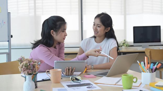 Startup business people working on new project together in modern bright office interior.