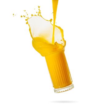 orange juice splash isolated on white. glass of splashing orange juice. fresh orange fruit juice splashing in glass. stock photo