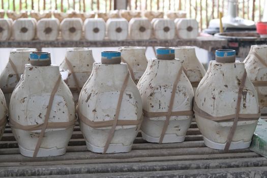 The molds for making vases are laid out on rack waiting for the soil to form. Process of making a ceramic vase. handicraft and small business concept.