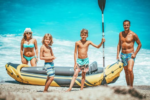 Rubber kayak is prepared for happy family sailing at the beach. 