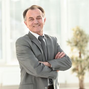 portrait of a successful Mature businessman in modern office photo with copy space