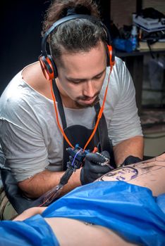 Master shows tattoo paint tattoo parlour.