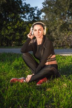 Fitness woman enjoys music./Athletic girl listens to music and enjoys it.