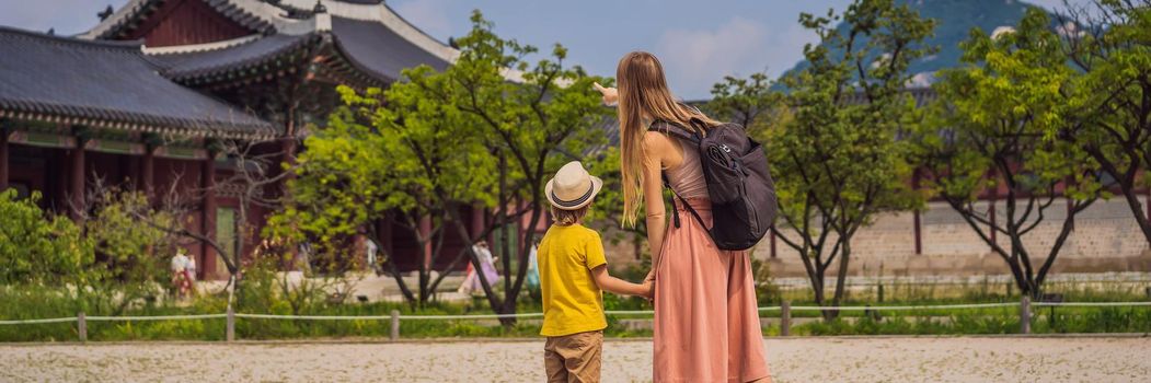 Mom and son tourists in Seoul, South Korea. Travel to Korea concept. Traveling with children concept. BANNER, LONG FORMAT
