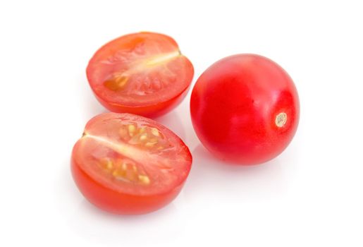 Cherry tomatoes isolated on a white cutout.