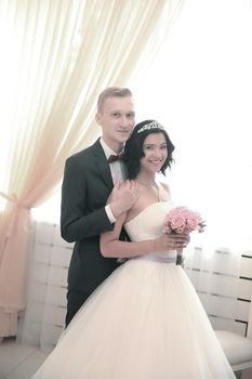 portrait of happy newlyweds after the wedding ceremony. photo with copy space