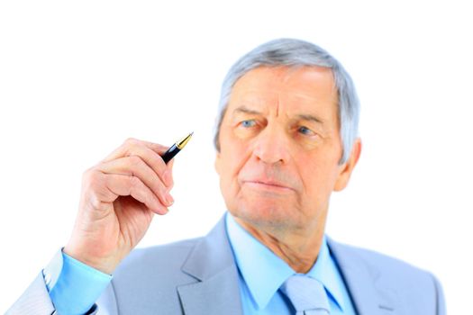 Nice businessman at the age, writes a pen in the air. Isolated on a white background.