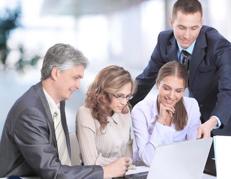 business team discussing business issues sitting at their Desk .photo with copy space