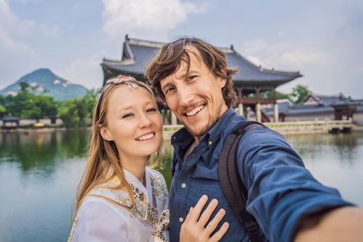 Young couple of spouses, a bride and groom, a husband and wife, boyfriend and girlfriend spend time in Korea. Holidays in Korea. Honeymoon, travel to Korea concept.