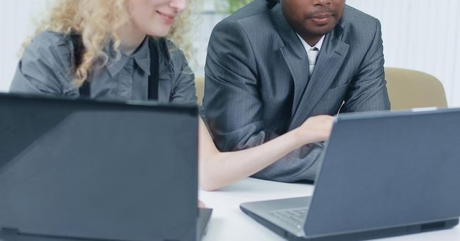 younger employees discussing business issues in office.photo with copy space