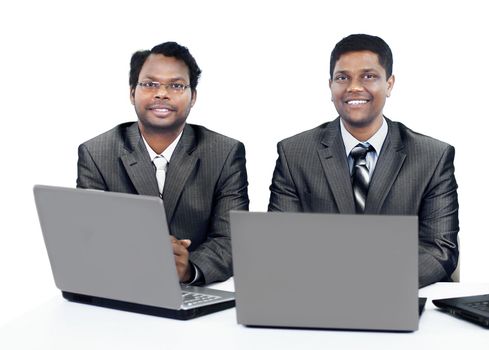 Interracial business team working at laptop in a modern office