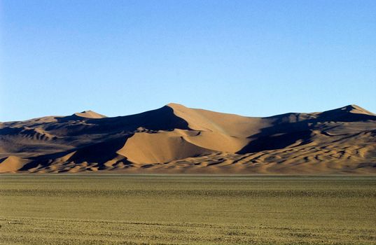 Panoramic view of red sand dunes in famous Namib Desert in Namibia