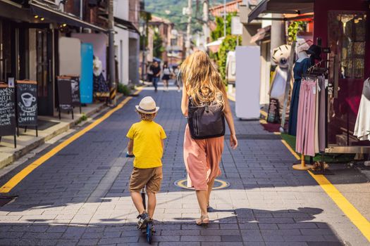 Mom and son tourists in Bukchon Hanok Village is one of the famous place for Korean traditional houses have been preserved. Travel to Korea Concept. Traveling with children concept.