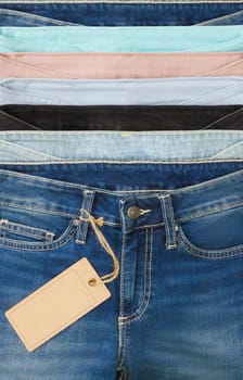 Set of multicolored jeans lined with each other in a row