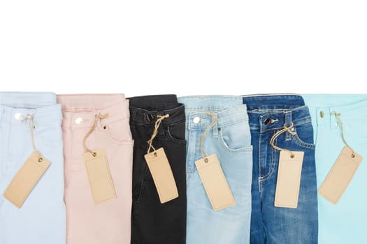 Set of multicolored jeans lined with each other in a row