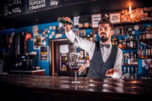 Barman concocts a cocktail in the beerhall