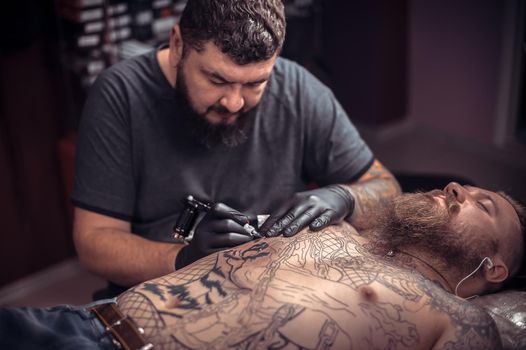 Tattoo artist at work.
