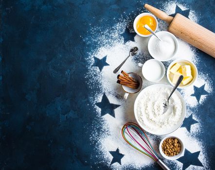 Baking background. Flour, white, brown sugar, eggs, butter, milk, cinnamon sticks, whisk, rolling pin. Ingredients for baking. Kitchen utensils. Space for text. Top view. Making baked goods. Concept