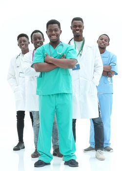 in full growth. smiling young doctors standing one by one . isolated on white