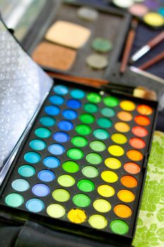 Professional make-up tools and multicolored palette, closed-up